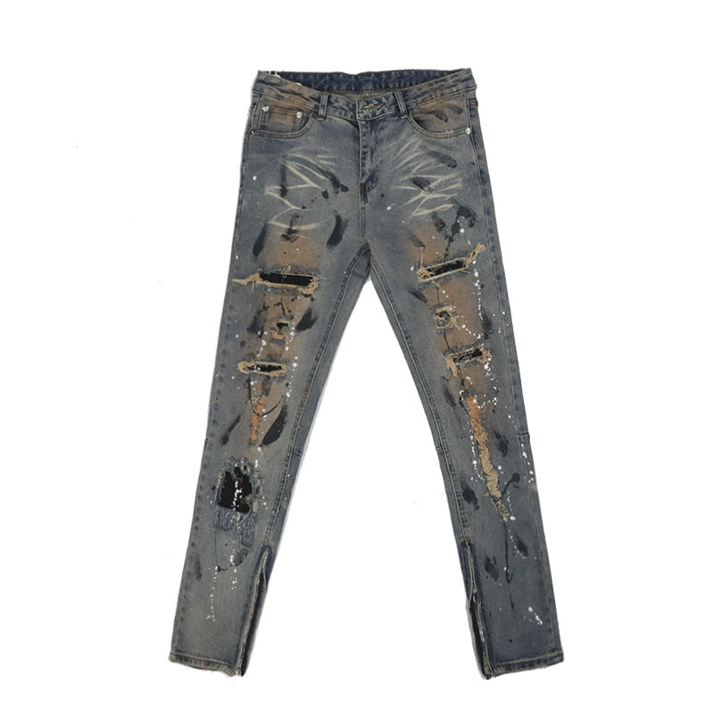 Distressed And Ink-sprayed Small-footed Jeans With Ripped Patches