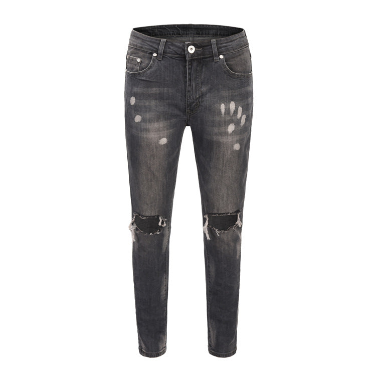 High street kanye spray-painted knee-cut slim-fit jeans