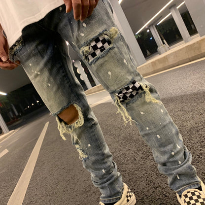 Ripped high street style checkerboard patch denim trousers