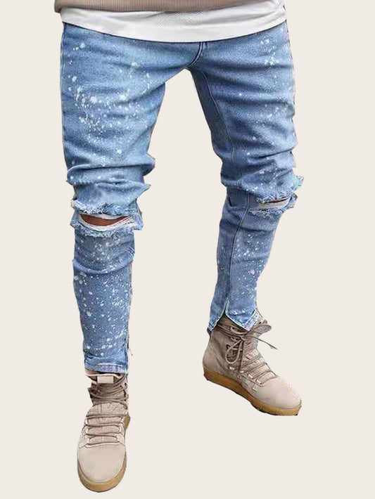 Washed jeans with small zipper holes