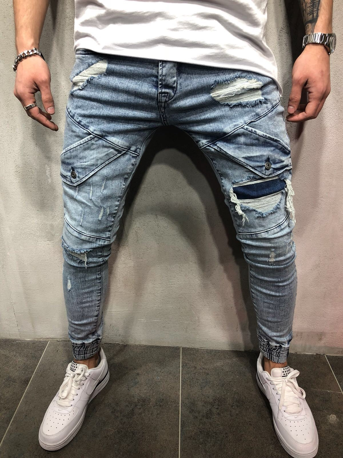 Cross-border foreign trade explosion models new men's slim jeans black hole men's denim beam blue feet pants