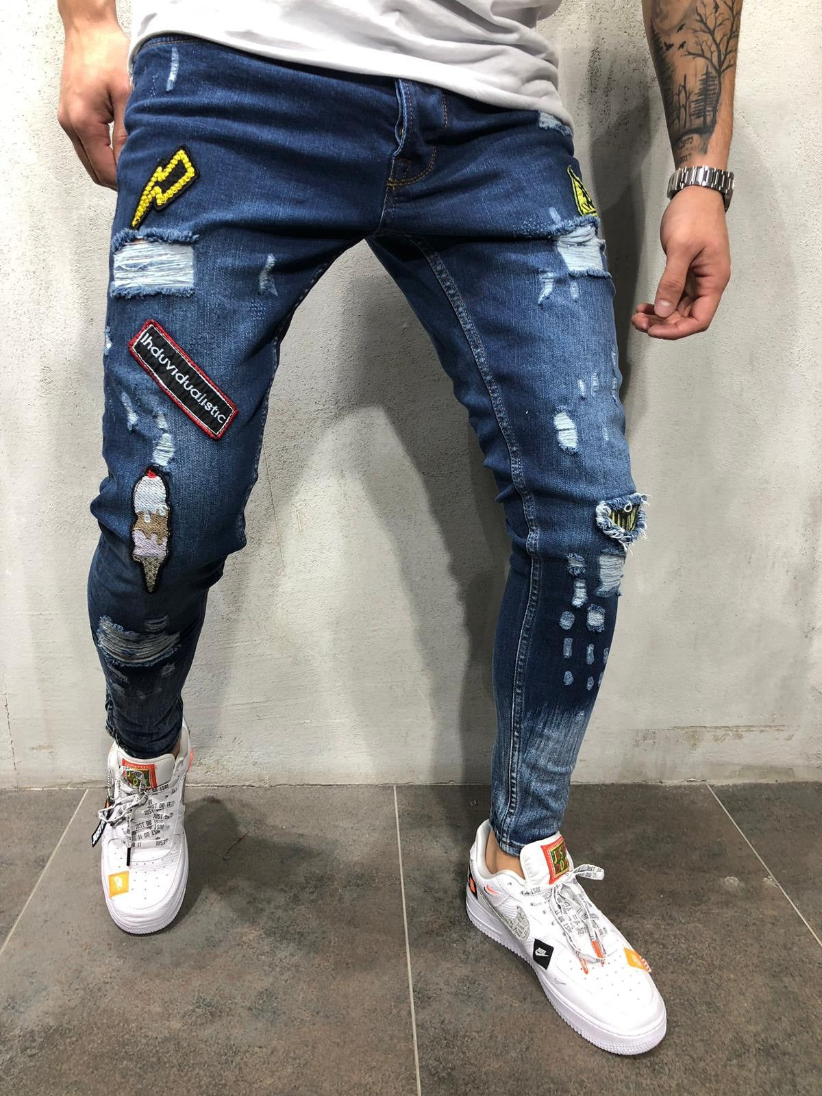 Blue ripped logo jeans