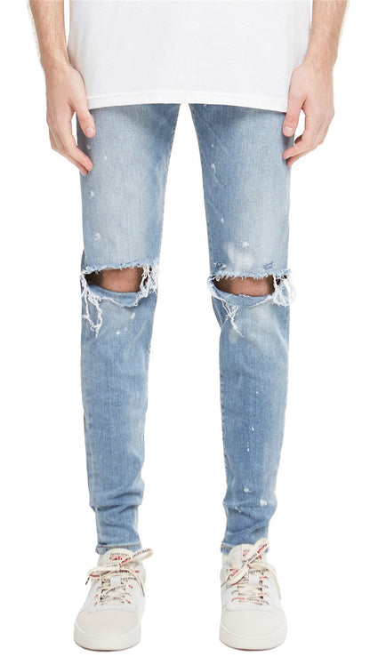 High street kanye spray-painted knee-cut slim-fit jeans