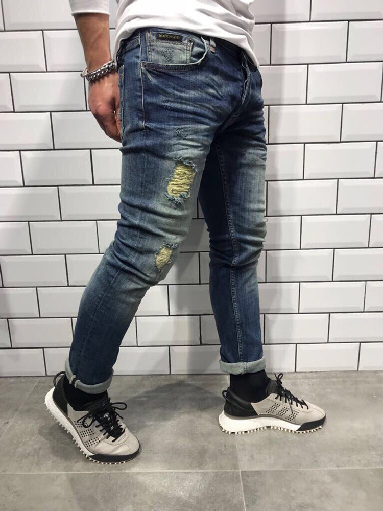 Men's hole small feet jeans Europe and the United States new denim trousers